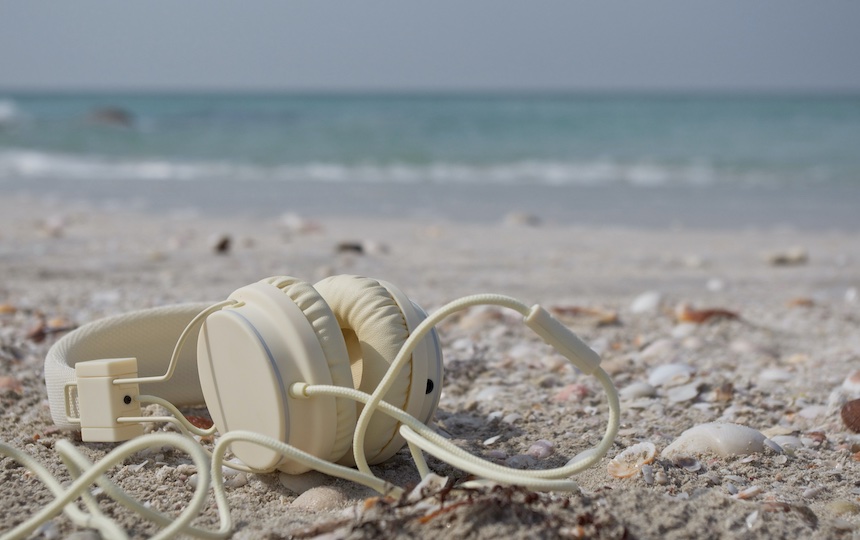 A pair of headphones on the beach